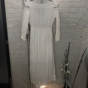 Brand new white off the shoulder mid length dress.